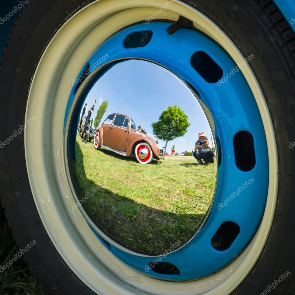 Reflections Of An Old Car In The Decorative Wheel Covers Stock