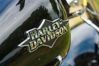 The fuel tank of a motorcycle Harley-Davidson close-up clipart