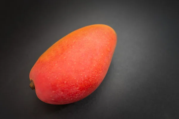 Mango on a dark. — Stock Photo, Image