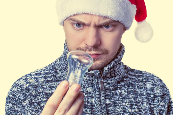 Man looking at light bulb. — Stock Photo, Image