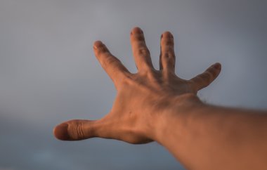 Hand reaching to sky. clipart