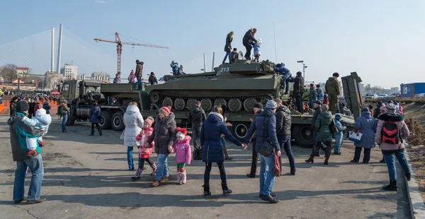 Children play on modern russian armored vehicle. — Stock Photo, Image