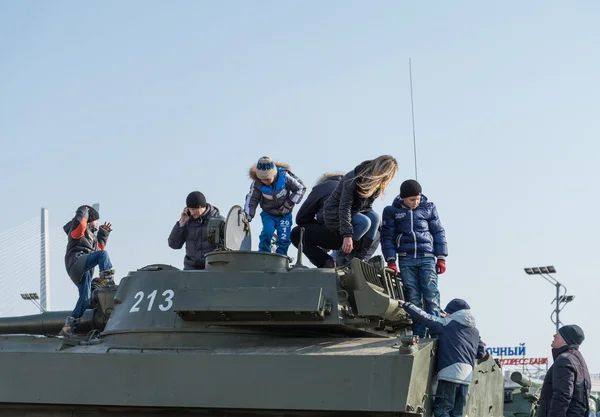 Children play on modern russian armored vehicle. — Stock Photo, Image