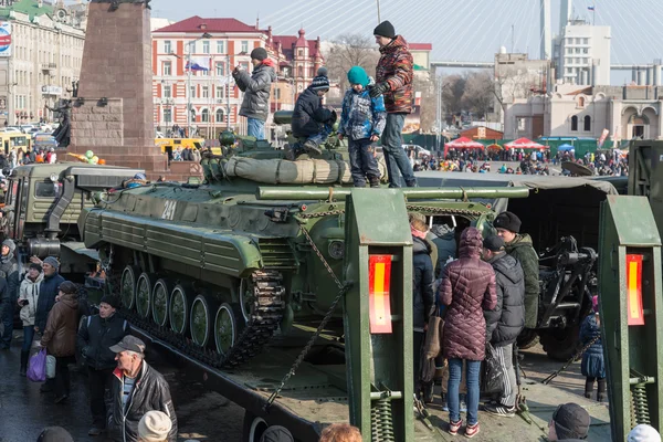 Children play on modern russian armored vehicle. — Stock Photo, Image