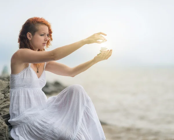 Woman holding zen stones. — Stock Photo, Image