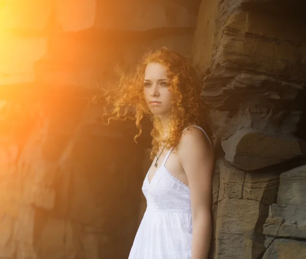 Redhead woman in a white dress. — Stockfoto