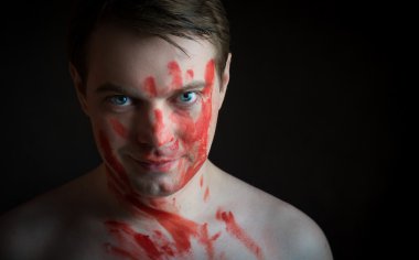 Man with blood on his face. clipart