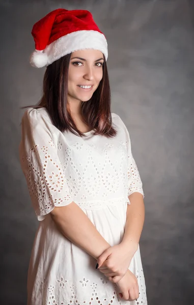 Mulher em santa chapéu. — Fotografia de Stock