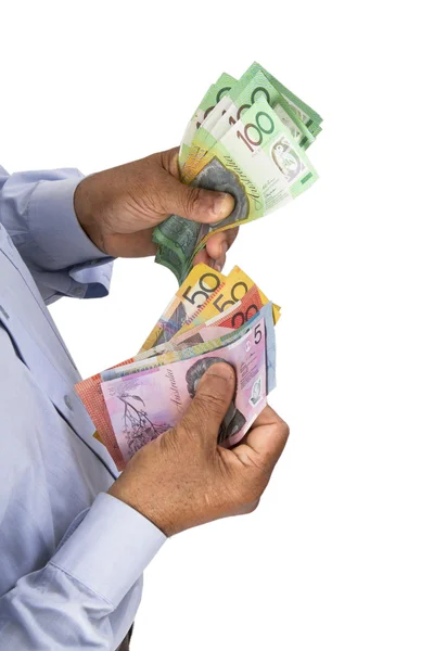 Homme vérifiant ou comptant les dollars australiens en main . — Photo