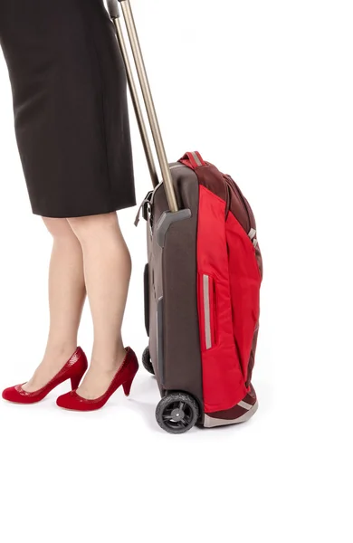 Woman in Black Skirt Pulling a Carry On Bag Isolated on White — Stock Photo, Image