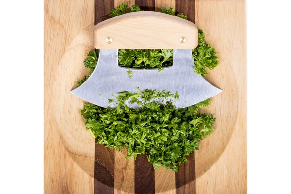 Ulu Knife and Chopped Parsley on a Wooden Block — Stock Photo, Image