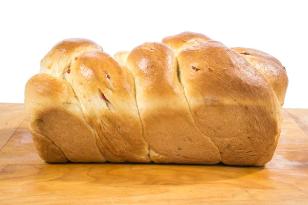 Homemade Fancy Braided Herb and Sundried Tomato Bread on a Cutting Board — Stock Photo, Image