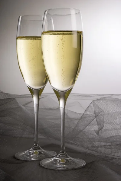 Two Glasses of Champagne on Grey Background — Stock Photo, Image