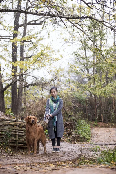 Girl and her pet dog — Stock Photo, Image