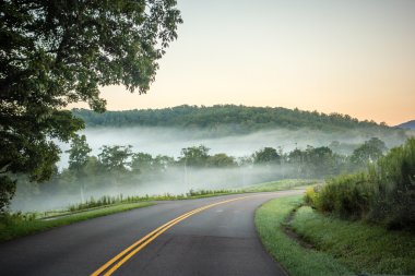 fog rolling through blue ridge parkway farm lands clipart