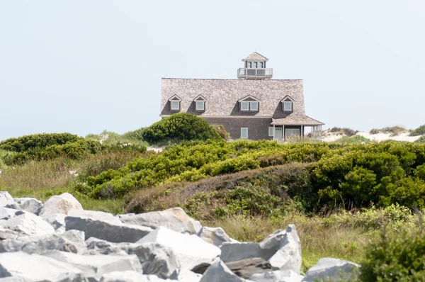 The restored Oregon Inlet Life Saving Station stands on the Nort