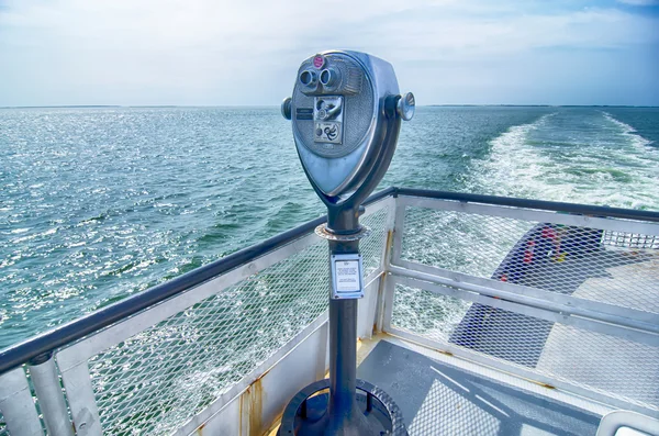 Binoculars watching at horizon on ship deck — Stock Photo, Image