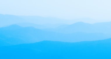 Panorama  of mountain ridges silhouettes clipart
