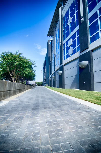 Walking along stadium on a boulevard city street — Stock Photo, Image