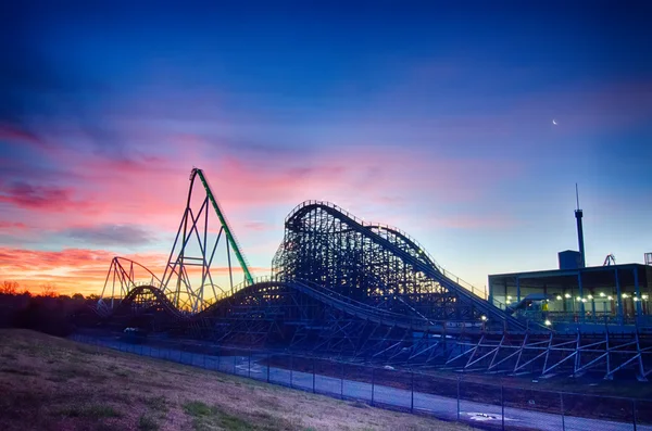 Curves of a roller Coaster at Sunset or sunrise — Stock Photo, Image