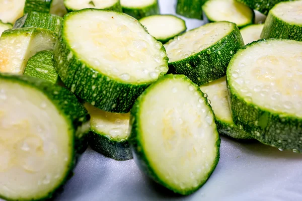 Sliced zucchini prepared for grilling on a picnic — Stock Photo, Image