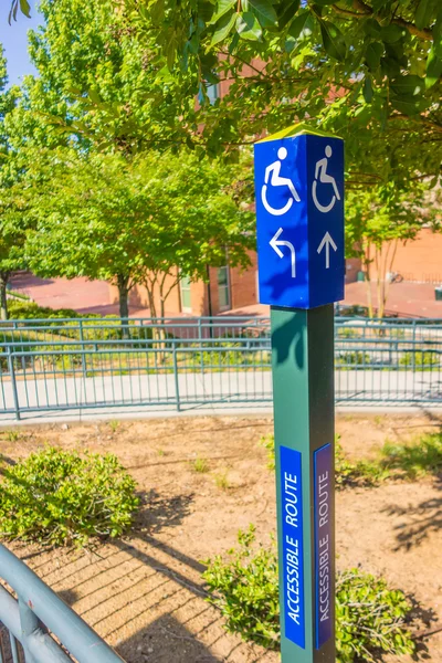 Blue handicapped wheel chair post sign — Stock Photo, Image