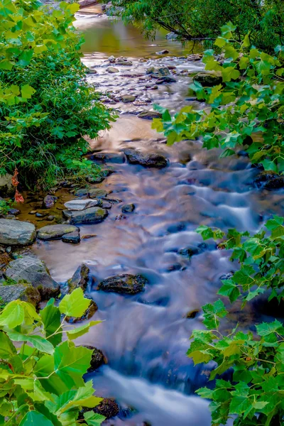 River stream flowing over rock formations in the mountains — Stock Photo, Image