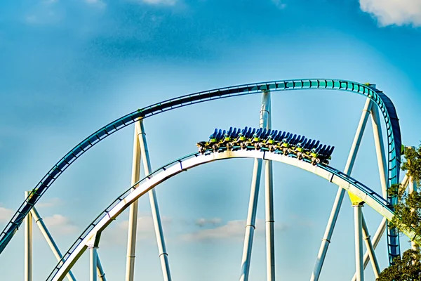 Crazy rollercoaster rides at amusement park — Stock Photo, Image