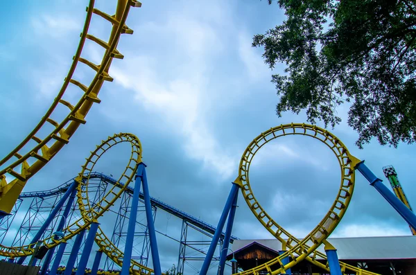 Crazy rollercoaster rides at amusement park — Stock Photo, Image