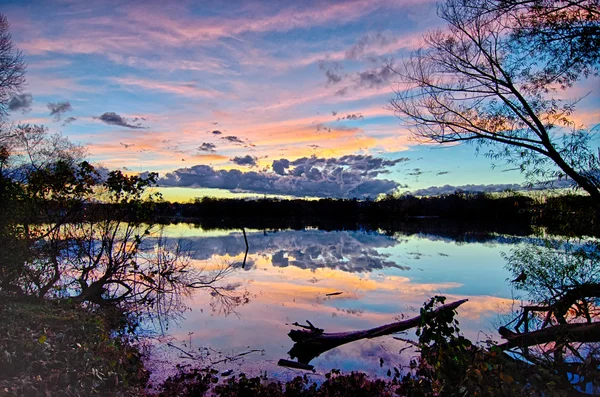 Sunset and reflection with beautiful sky rainbow colors — Stock Photo, Image