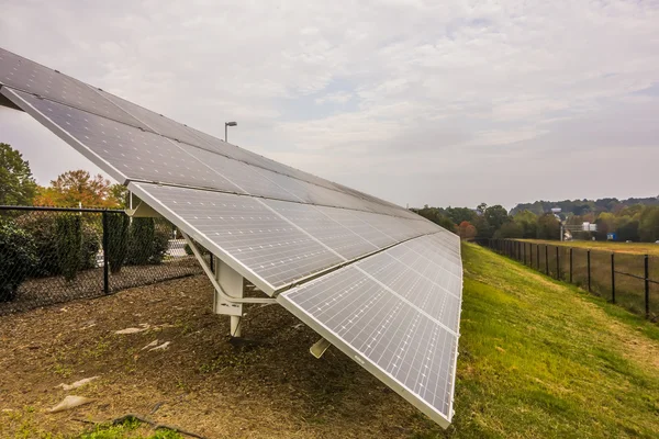 Green energy solar panels on a cloudy day — Stock Photo, Image