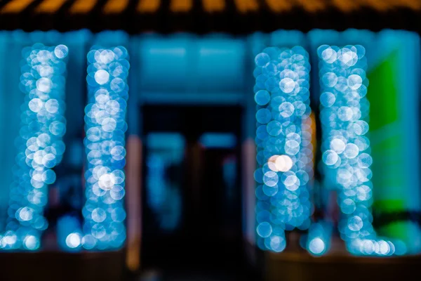 Defocused storefront sidewalk lights at night — Stock Photo, Image