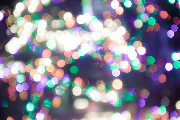 Desenfocado bokeh luces de árbol de Navidad — Foto de Stock