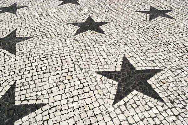 Portugiesisches Pflaster, Lissabon, Portugal lizenzfreie Stockbilder