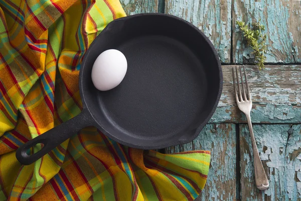 Iron pan with egg — Stock Photo, Image