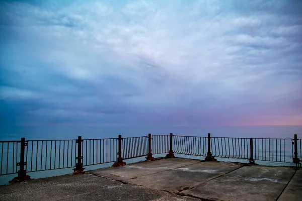 Beautiful sunrise on the old sea pier — Stock Photo, Image