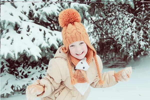 Five years girl near snow-covered fir tree — Stock Photo, Image