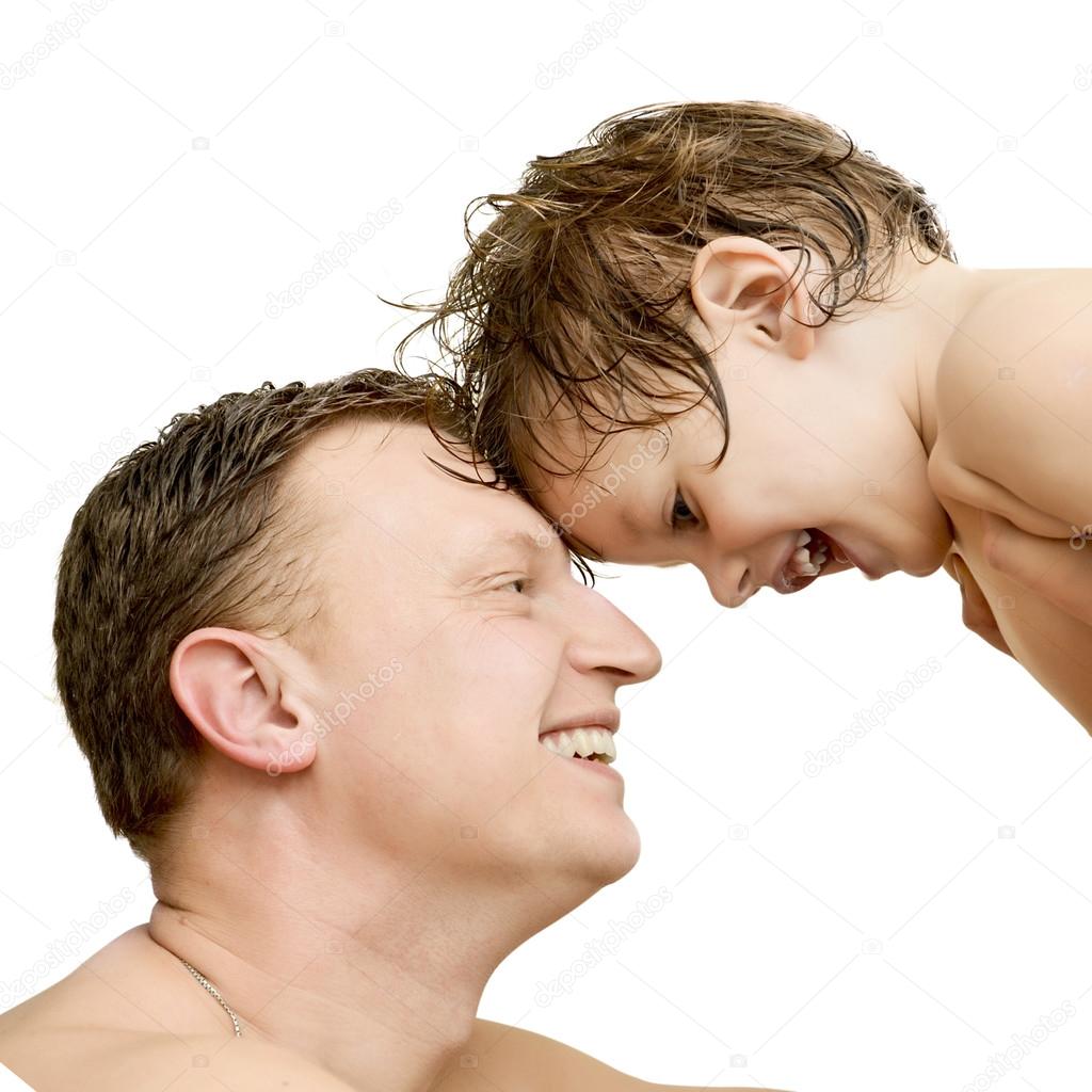 Cute boy taking a bath with foam