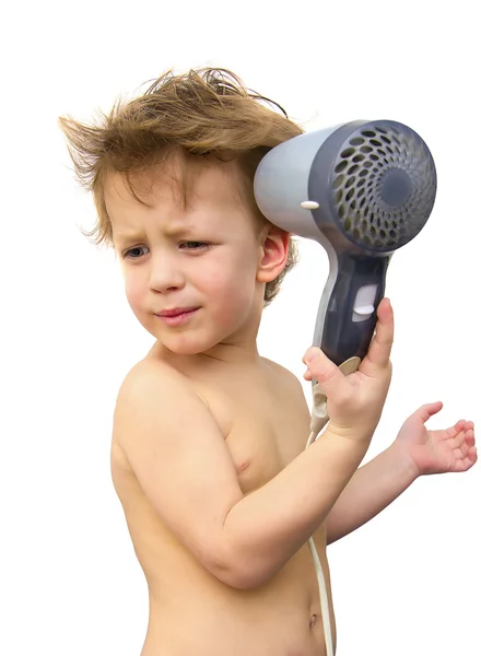 Niño con secador de pelo sobre blanco — Foto de Stock
