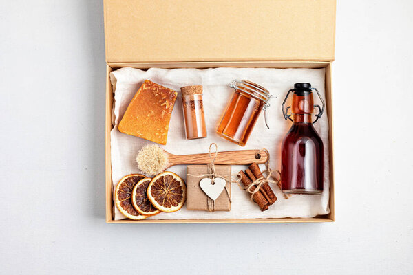 Preparing self care package, seasonal gift box with plastic free zero waste cosmetics products. Personalized eco friendly basket for family and friends for thankgiving, christmas, mothers day  