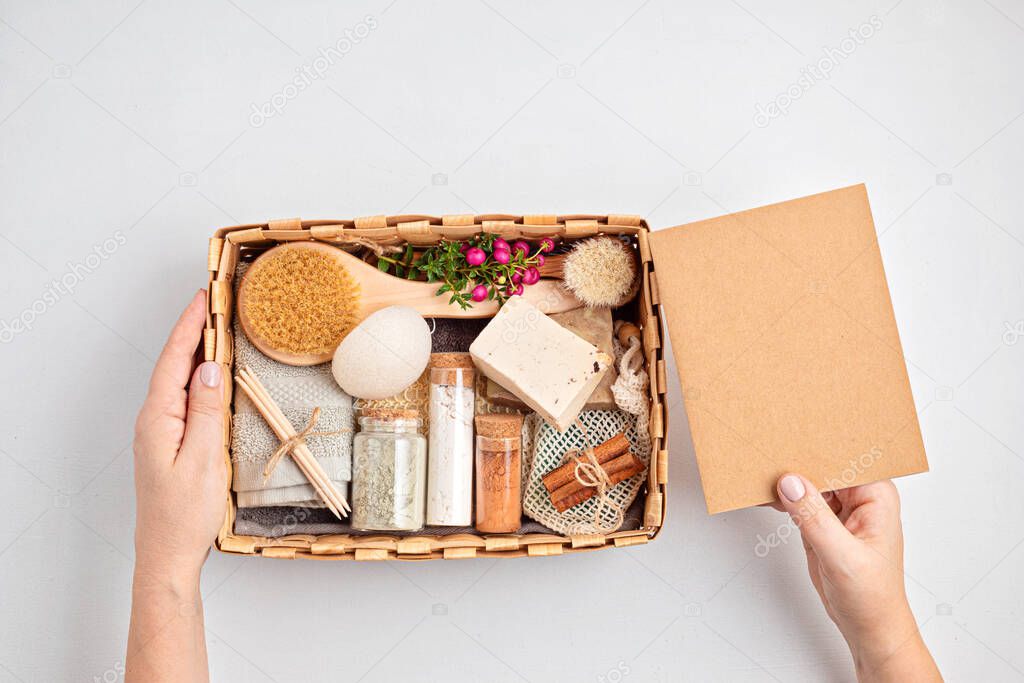 Preparing self care package, seasonal gift box with plastic free zero waste cosmetics products. Personalized eco friendly basket for family and friends for thankgiving, christmas, mothers day  