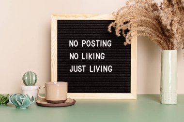 No posting, no liking, just living motivational quote on the letter board. Inspiration text for digital detox clipart