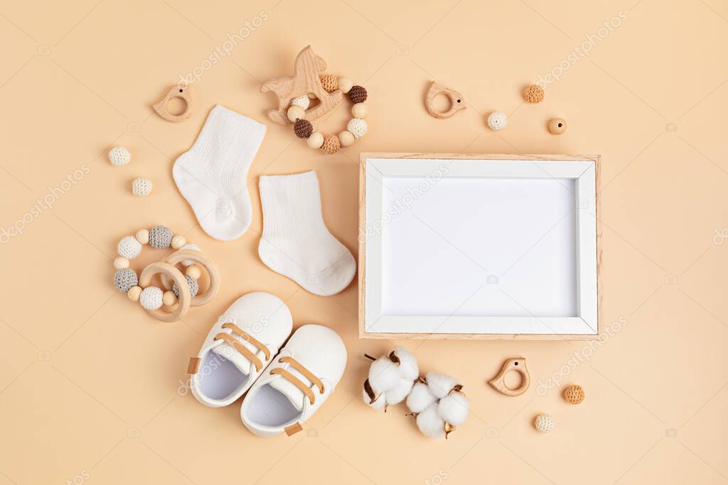 Mockup of empty frame with eco friendly baby accessories