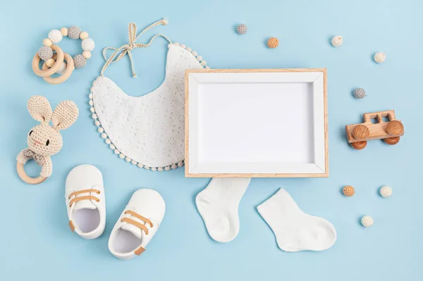 Mockup of empty frame with white baby accessories, baby shower, baptism invitation — Stock Photo, Image