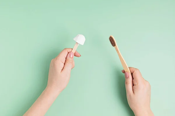 Bamboo toothbrush and solid organic toothpaste. Zero waste sustainable lifestyle idea — Stock Photo, Image