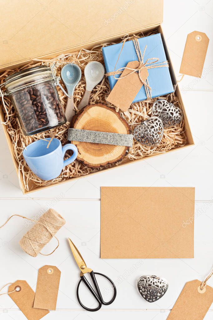 Preparing care package, seasonal gift box with plastic free, zero waste products for coffee lovers