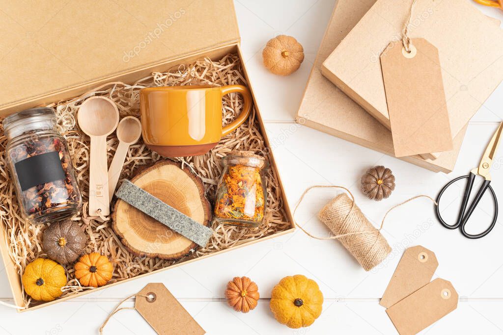 Preparing care package, seasonal gift box with plastic free, zero waste products.