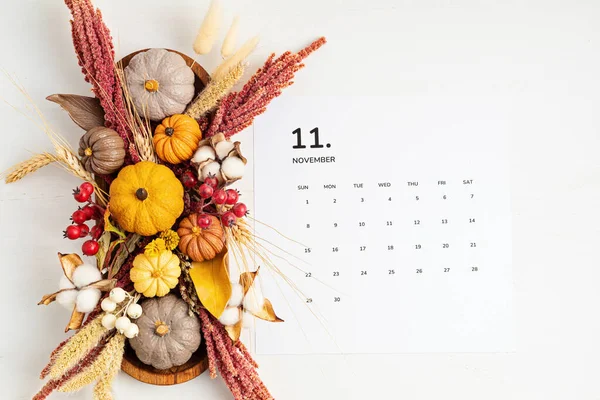 Flat lay with calendar for november with autumn table decoration — Stock Photo, Image