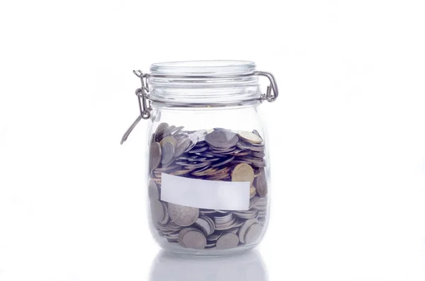 Glass jar filled with coins Stock Photo