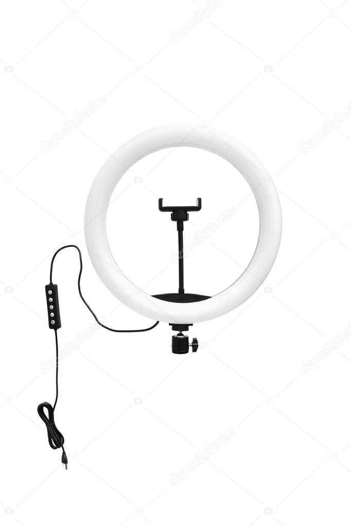 Closeup of circular neon LED lamp isolated white background. Popular modern light for make-up and beauty portraits.